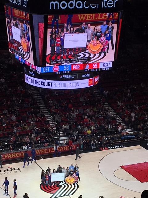 View of the video board showing the students on the Blazers court